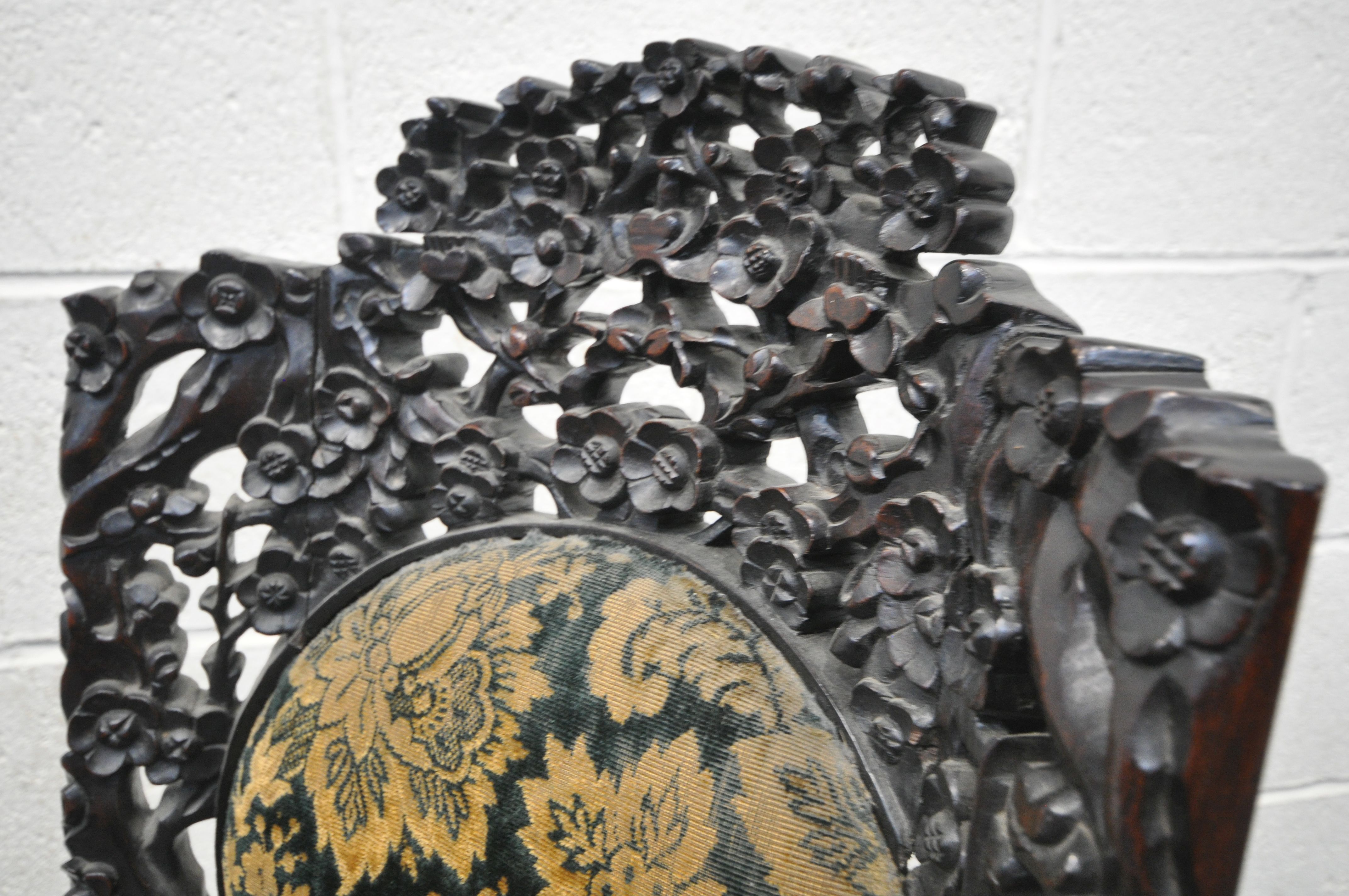 AN INTRICATLY CARVED CHINESE HARDWOODCHAIR, late 19th/early 20th century, flower heads and vines - Image 4 of 10