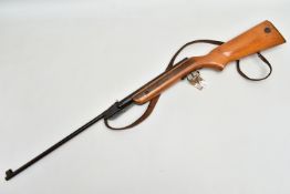 A .22” RELUM SPRING ACTION AIR RIFLE, serial number 26642, fitted with an under lever cocking arm,