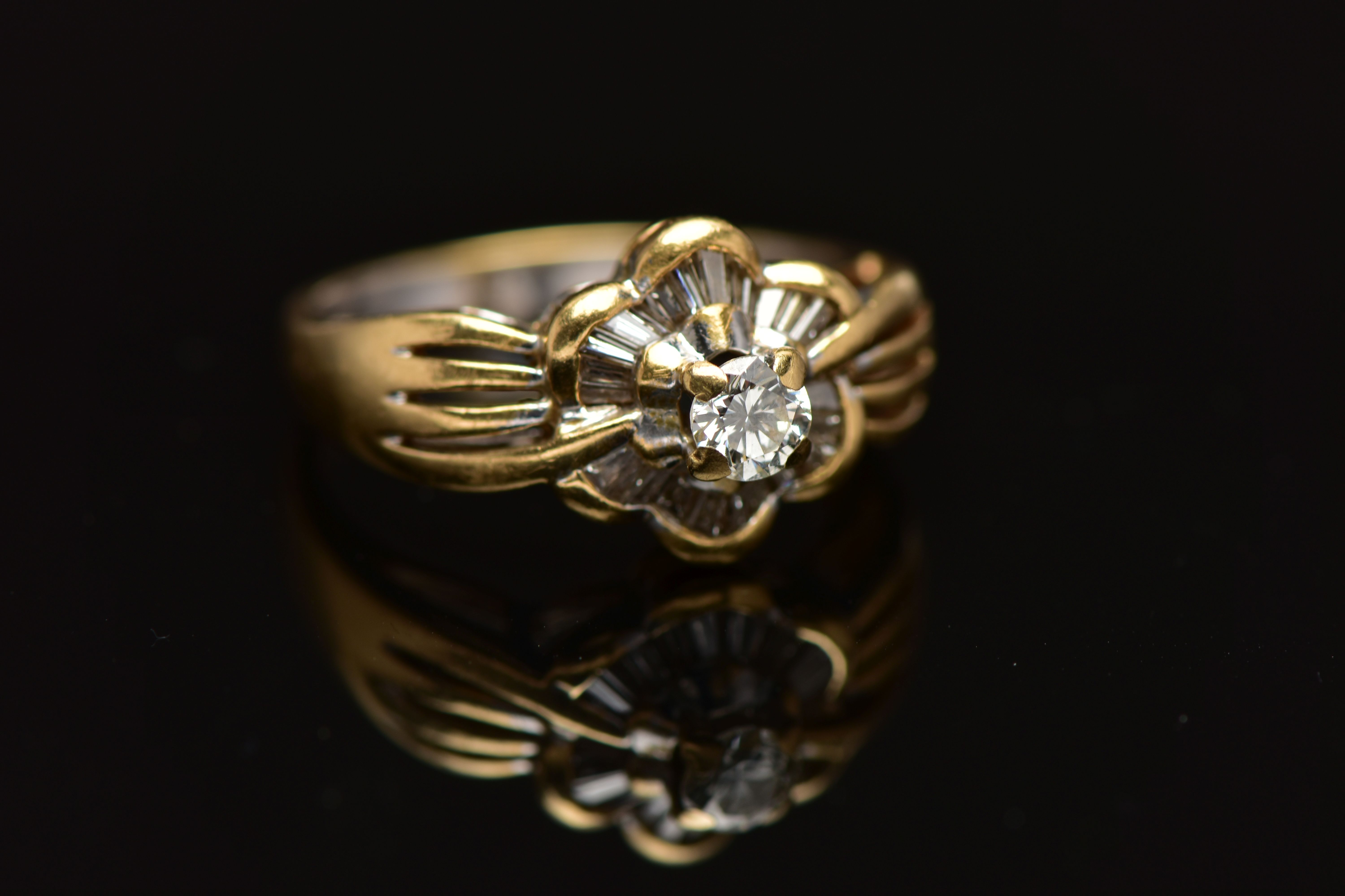 A MODERN YELLOW METAL DIAMOND CLUSTER RING, set with a principal round brilliant cut diamond, within - Image 6 of 8