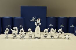 A BOXED SET OF SWARVOSKI CRYSTAL DISNEY SNOW WHITE AND THE SEVEN DWARVES FIGURES AND TITLE PLAQUE,