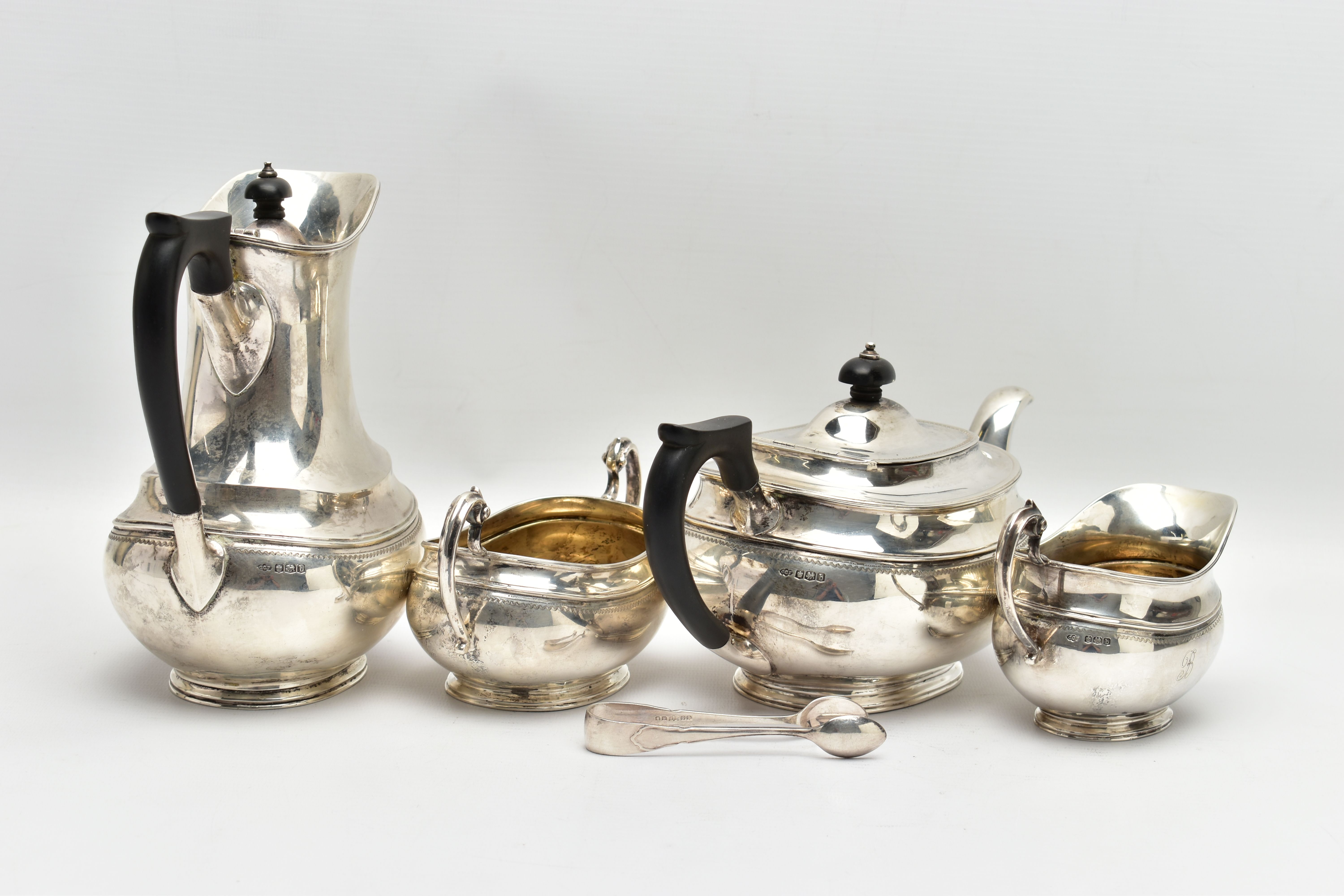 A GEORGE V SILVER FOUR PIECE TEA SERVICE OF OVAL FORM, comprising tea pot, hot water/coffee jug, - Image 6 of 9