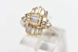 A MODERN DIAMOND CLUSTER RING, set with two principal baguette cut diamonds, graduating baguette cut