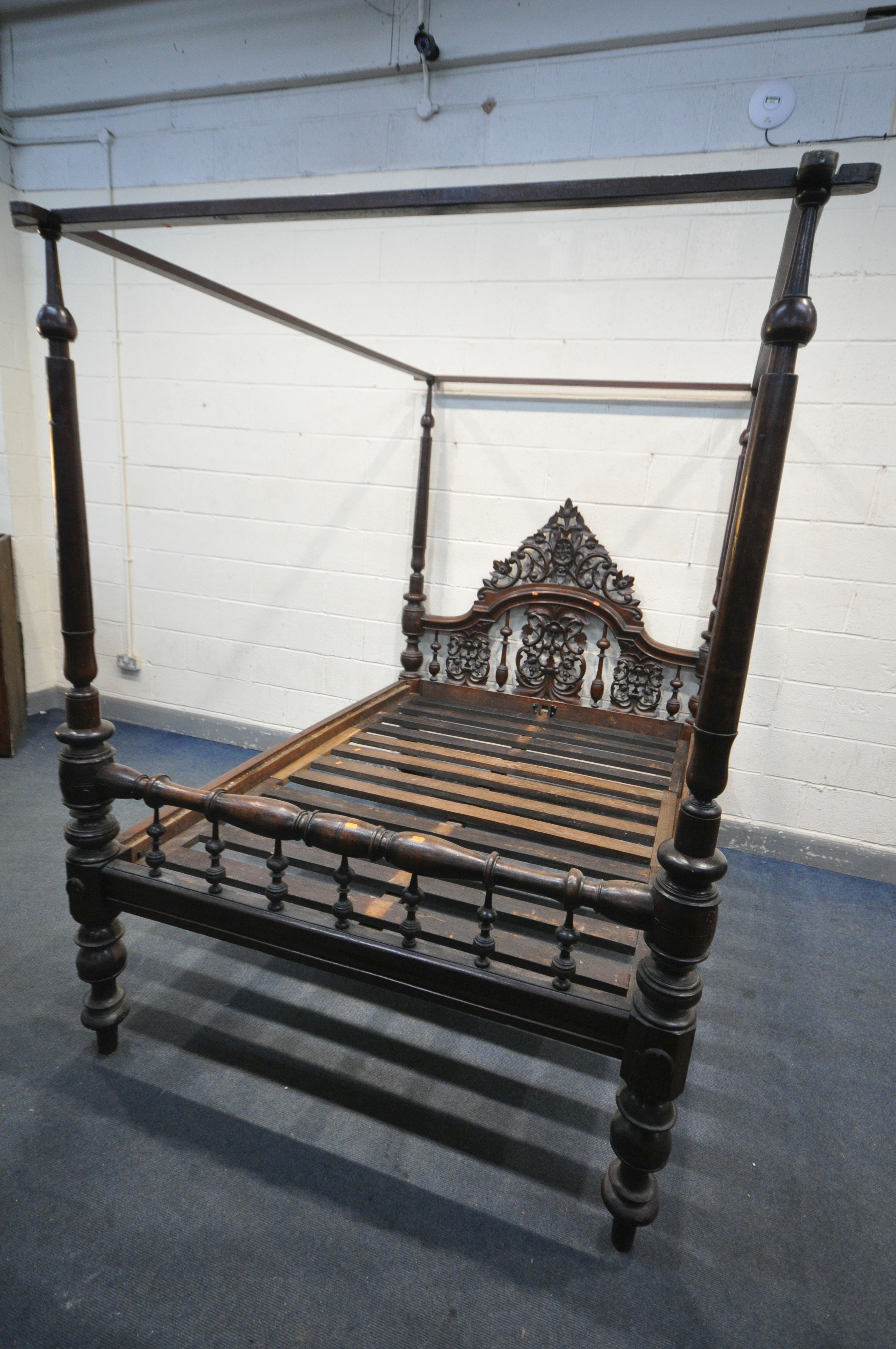 AN 18TH CENTURY OAK AND MAHOGANY 4FT6 FOUR POSTER BED, having a foliate open fretwork headboard,