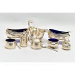A PAIR OF GEORGE V SILVER NAVETTE SHAPED SALTS, FOUR OTHER SILVER CRUET ITEMS, A GEORGE V SILVER
