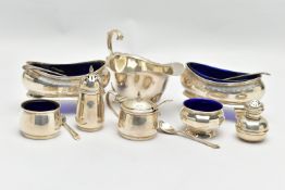 A PAIR OF GEORGE V SILVER NAVETTE SHAPED SALTS, FOUR OTHER SILVER CRUET ITEMS, A GEORGE V SILVER