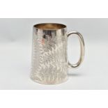A VICTORIAN SILVER TANKARD OF CONICAL FORM, C scroll handle, the body engraved with ferns