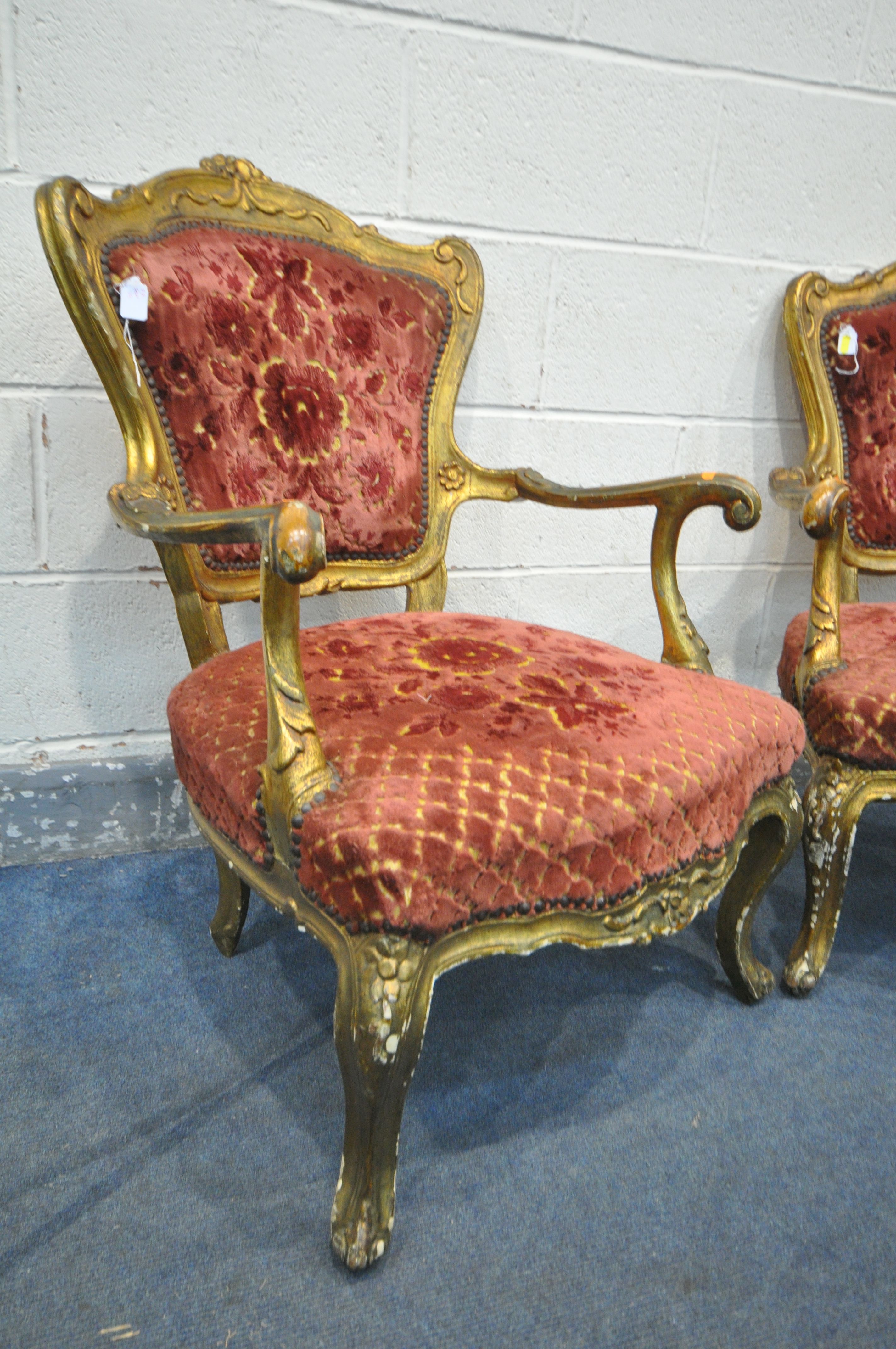 A PAIR OF 19TH CENTURY OR EARLIER LOUIS XV GILT FRAMED OPEN ARMCHAIRS, covered with later - Image 2 of 8