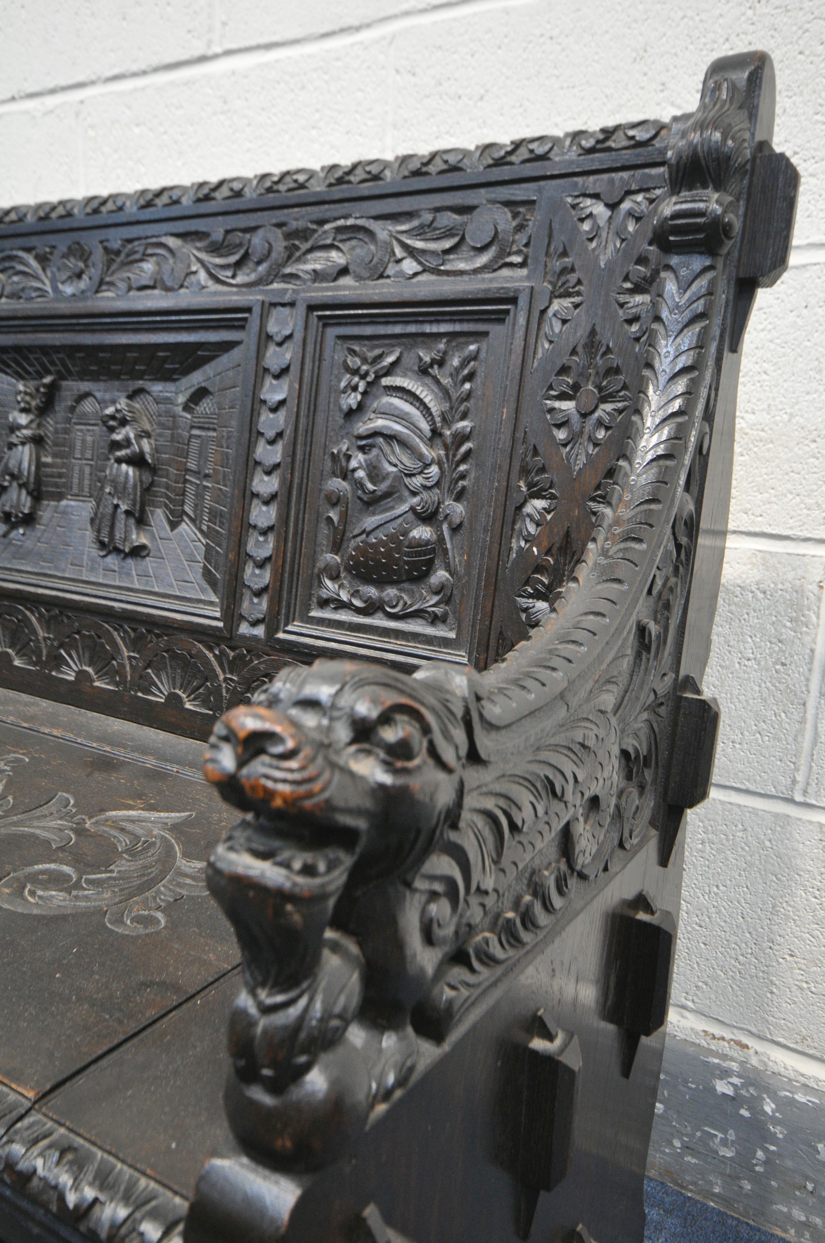 A LATE 19TH CENTURY CARVED OAK JACOBETHAN STYLE HALL SETTLE/BENCH, the two outer panels depicting - Image 3 of 9