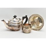 AN EDWARDIAN SILVER BACHELOR'S TEA POT OF SHAPED OVAL FORM, A TWIN HANDLED SILVER SUGAR BOWL AND A