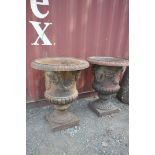 A PAIR OF LARGE WEATHERED CAST IRON CAMPAGNA GARDEN URNS, having egg and dart rim, four masks