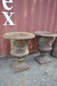 A PAIR OF LARGE WEATHERED CAST IRON CAMPAGNA GARDEN URNS, having egg and dart rim, four masks