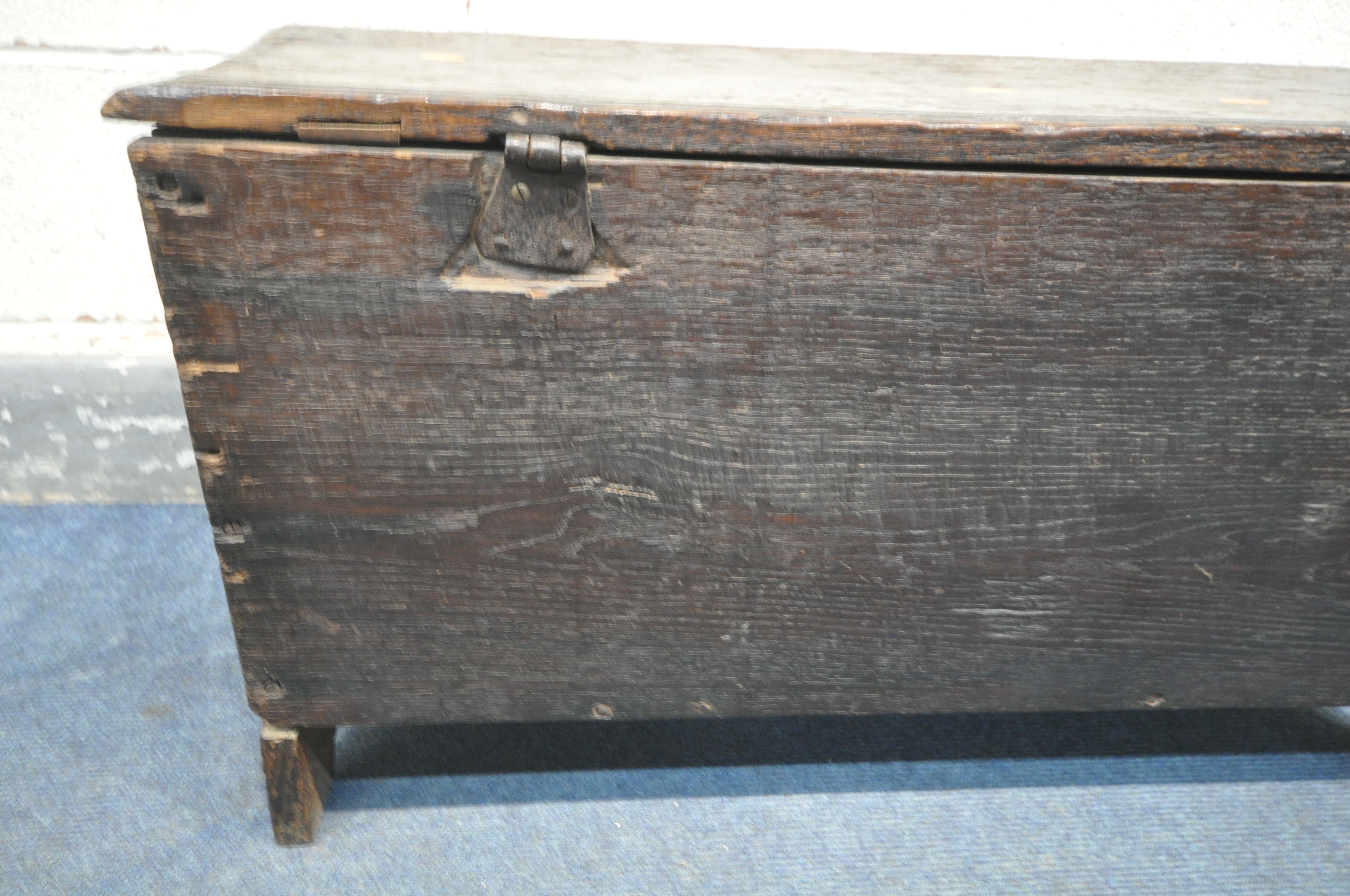 A 17TH CENTURY OAK COFFER, made up of six planks, the carved front with depicting two standing males - Image 9 of 9