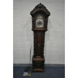 A 20TH CENTURY OAK EIGHT DAY LONGCASE CLOCK, within a heavily carved case with a peacock to