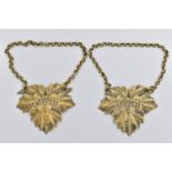 A PAIR OF GEORGE IV SILVER GILT DECANTER LABELS, cast as vine leaves, named for 'SHERRY' and '