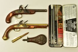 AN ANTIQUE 16 BORE FLINTLOCK PISTOL FITTED WITH A 7¾” BRASS BARREL AND WALNUT STOCK, the early