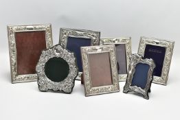 SEVEN MODERN SILVER EASEL BACK PHOTOGRAPH FRAMES, comprising four matching frames of rectangular