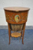 AN EARLY 20TH CENTURY SHERATON REVIVAL STYLE SATINWOOD OVAL WORK TABLE, with hand painted