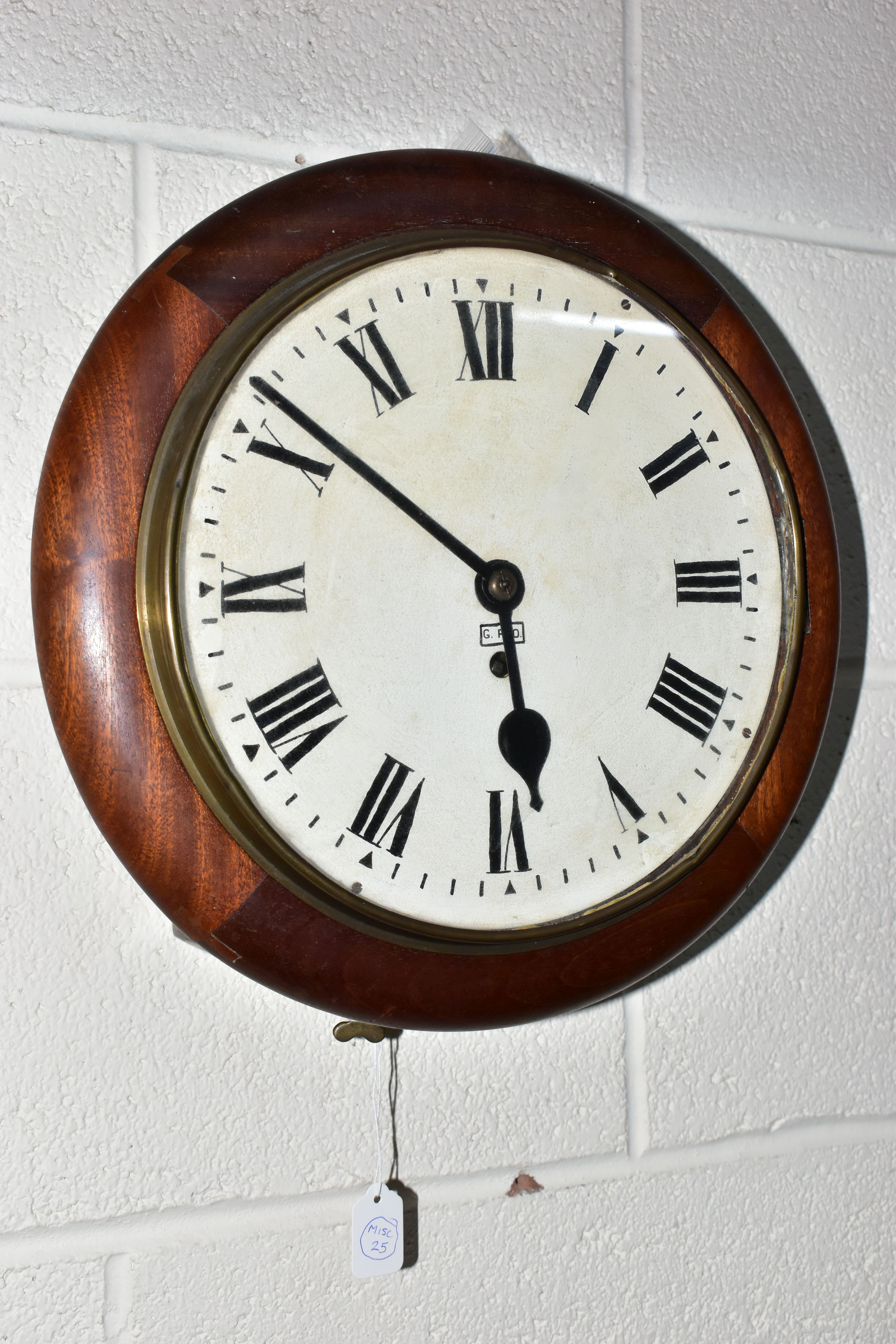 A VICTORIAN AND LATER MAHOGANY CASED THIRTY HOUR CIRCULAR WALL CLOCK, the painted 24.5cm dial with