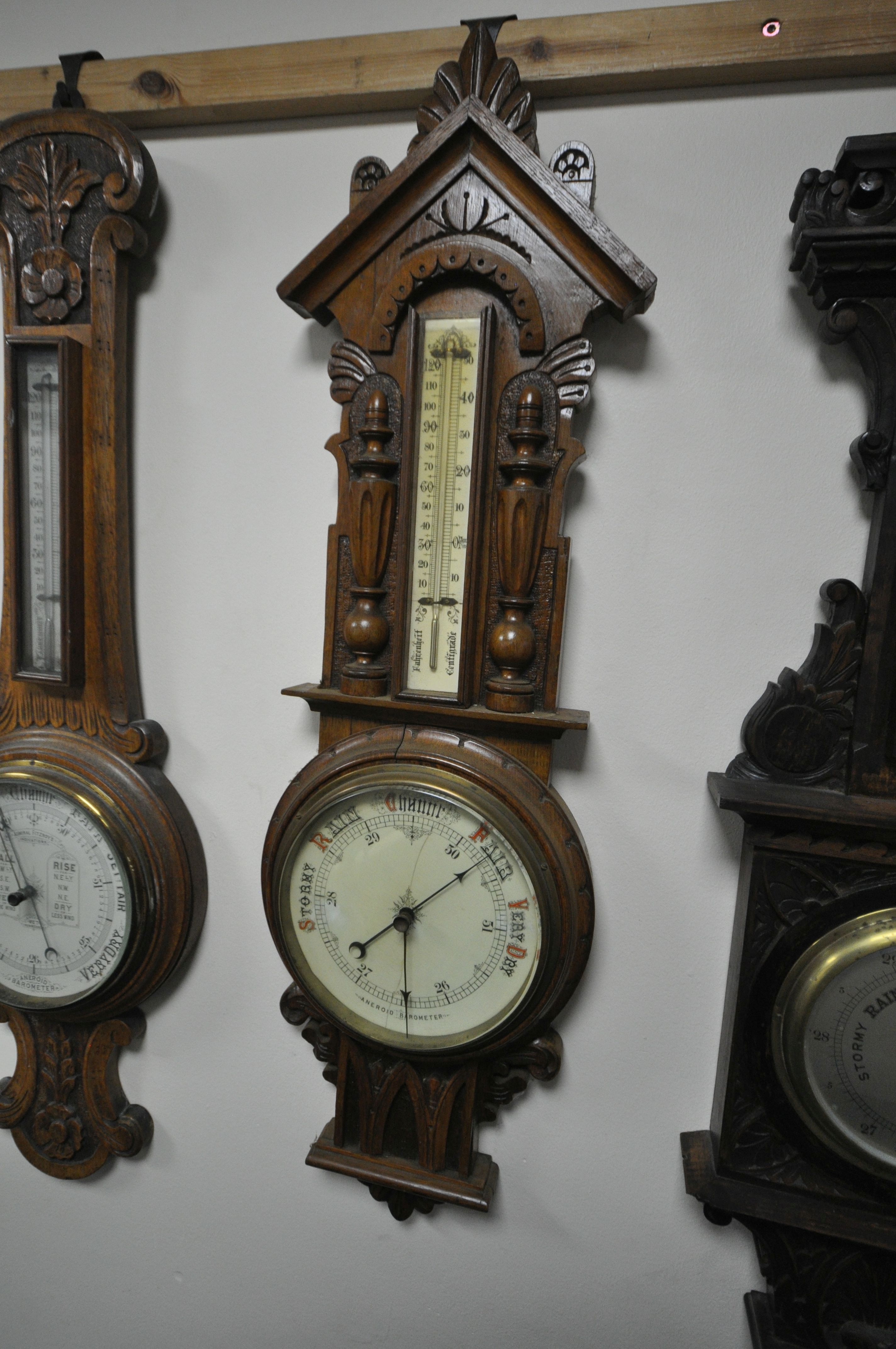 THREE LATE 19TH/EARLY 20TH CENTURY CARVED WOOD ANEROID BAROMETERS, all with thermometers and - Image 4 of 7