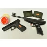 A BB GUN BASED ON THE DESIGN OF THE 9mm GLOCK PISTOL, plus a container of BB’s together with a