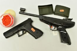 A BB GUN BASED ON THE DESIGN OF THE 9mm GLOCK PISTOL, plus a container of BB’s together with a