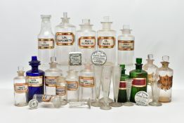 A COLLECTION OF SIXTEEN GLASS PHARMACY BOTTLES, thirteen clear, two green and one blue, a pair of