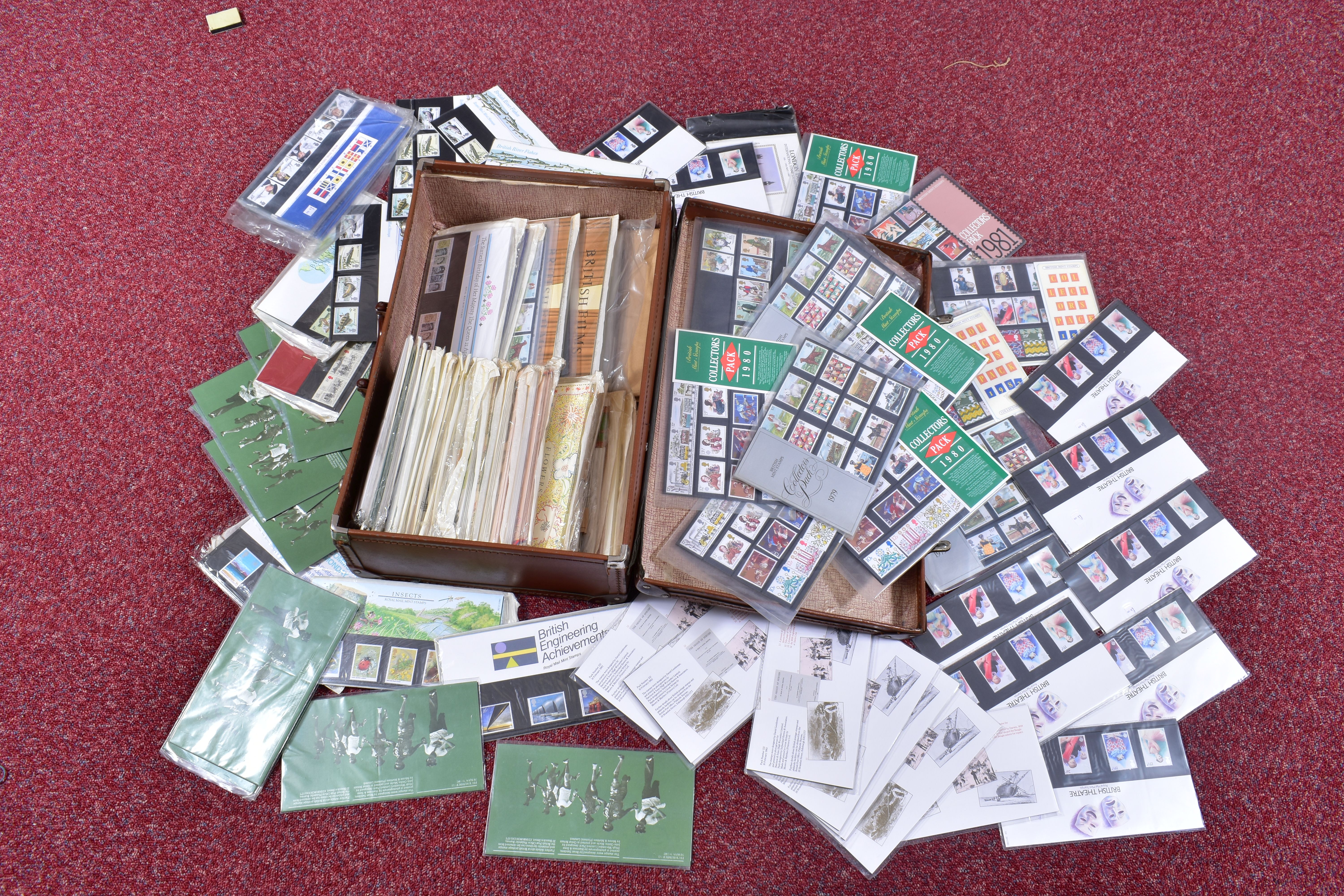 DUPLICATED GB PRESENTATION STAMP PACKS, in a battered old suitcase, year packs from 1980s, face