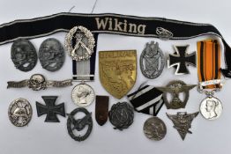 A BOX CONTAINING A NUMBER OF COPIES OF GERMAN COMBAT BADGES AND INSIGNIA, Iron Cross, Drivers Badge,