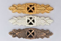 THREE EXAMPLES OF THE 1957 VARIANTS OF THE CLOSE COMBAT CLASP FOR THE HEER VETERANS, these are the