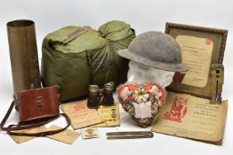 A LARGE BOX OF ASSORTED MILITARIA to include, WW1/2 British Helmet with liner, inert shell case(