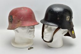 TWO INTER WAR/WW2 ERA FIRE POLICE HELMETS, one is painted red with only the inner leather band
