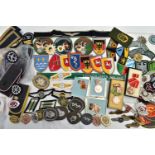 A BOX OF MILITARY INSIGNIA BOTH CLOTH AND METAL FOR THE GERMAN POST WW2 FORCES, East & West Germany,