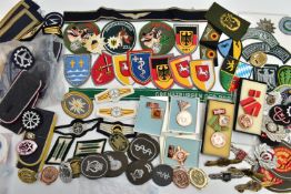 A BOX OF MILITARY INSIGNIA BOTH CLOTH AND METAL FOR THE GERMAN POST WW2 FORCES, East & West Germany,
