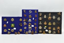 MILITARY CAP BADGES, three pads and some loose badges fifty six in number, inc RNAS, Royal Irish,
