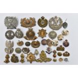 A BOX OF ASSORTED MILITARY BADGES, to include, Camerons London Scottish, Prince of Wales,