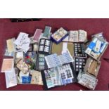 LARGE COLLECTION OF STAMPS IN BOXES AND TINS, including worldwide as kiloware and in junior type