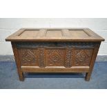A GEORGIAN OAK COFFER, with a carved panel front, width 105cm x depth 53cm x height 67cm (