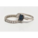 TWO WHITE METAL GEM SET RINGS, the first set with a rectangular cut sapphire, prong set, flanked