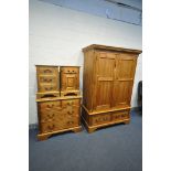 A PINE BEDROOM SUITE, comprising a double door wardrobe, with two drawers, width 136cm x depth