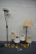 A BRASS SWING ARM FLOOR LAMP, a similar table lamp, along with a standard lamp with an uplight glass