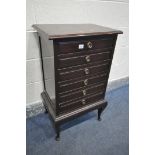 AN EDWARDIAN MAHOGANY SIX DRAWER MUSIC CABINET, on cabriole legs, width 53cm x depth 38cm x height