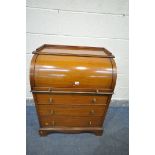 AN EDWARDIAN MAHOGANY AND INLAID BARREL FRONT BUREAU, with fitted interior, a pull out slide with