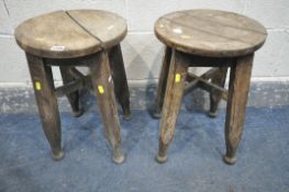 A PAIR OF GEORGIAN OAK CIRCULAR STOOLS, with dish seat, on square legs, united by a cross stretchers