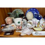 A GROUP OF CERAMIC ORNAMENTS comprising an ostrich egg on a square wooden stand, a Royal Doulton