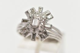 A WHITE METAL DIAMOND CLUSTER RING, raised cluster centring on a rectangular cut diamond in a collet