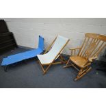 A MODERN BEECH ROCKING CHAIR, along with a folding pine framed deck chair, and a metal framed