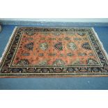 A 20TH CENTURY KULA RUG, with a red field, 250cm x 157cm, along with a gold floral rug, 215cm x