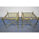 A PAIR OF MAISON JANSEN STYLE FRENCH BRASS SIDE TABLES, with smoked glass inserts, on Corinthian