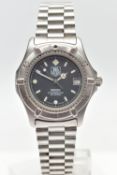 A 'TAG HEUER' QUARTZ WRISTWATCH, round black dial signed 'Tag Heuer, 2000 professional 200