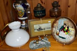 A GROUP OF VICTORIAN OIL LAMPS comprising two cast iron lamp bases with brass Duplex fittings one